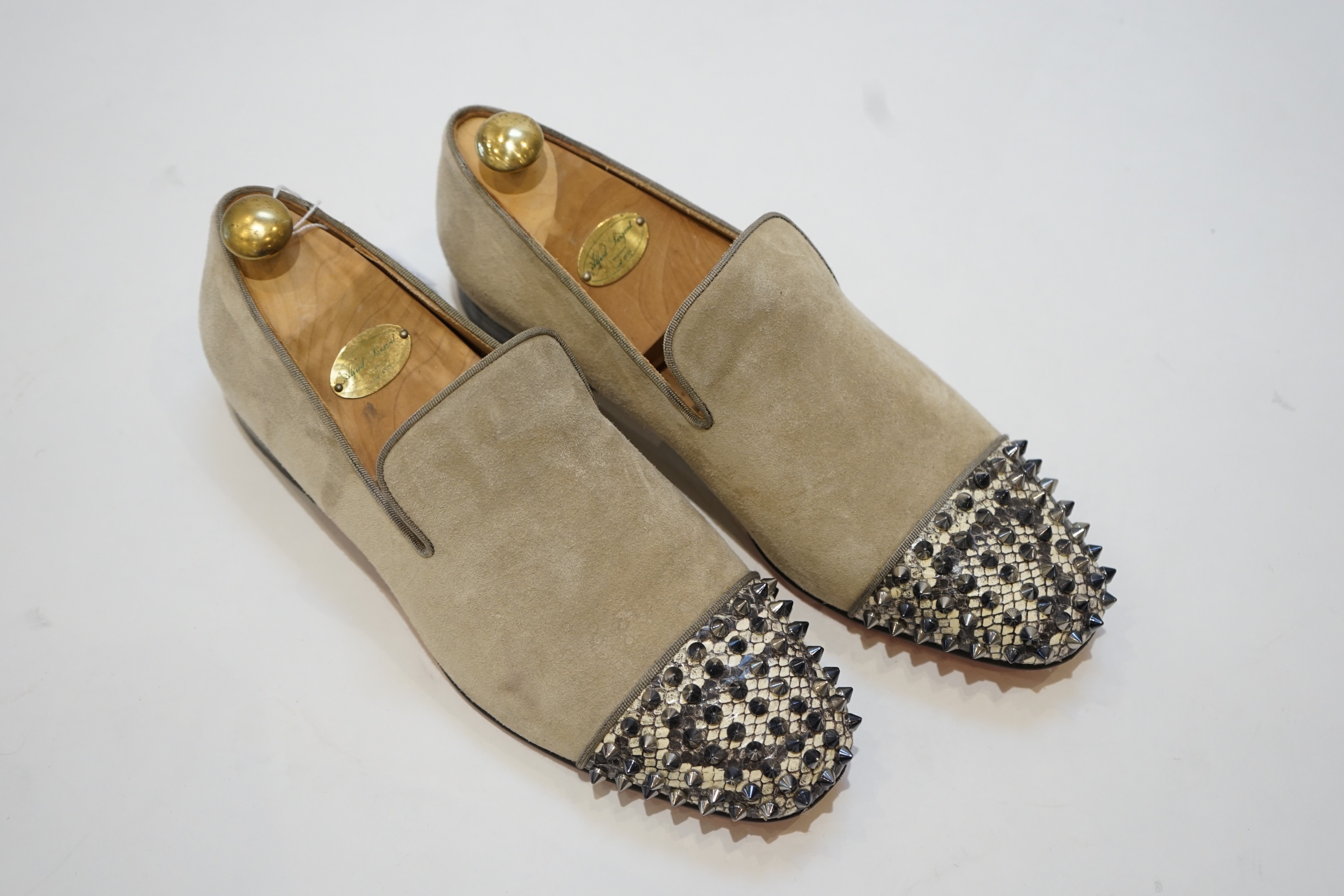 A pair of gentleman's Christian Louboutin suede and snakeskin effect studded loafers, size 42.5